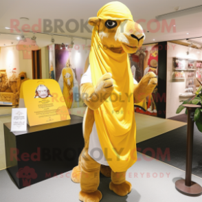 Yellow Camel mascot costume character dressed with a Long Sleeve Tee and Shawl pins