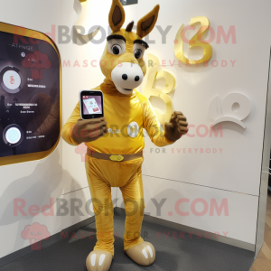 Gold Donkey mascot costume character dressed with a Playsuit and Digital watches