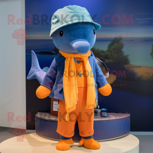 Orange Blue Whale mascot costume character dressed with a Cardigan and Berets