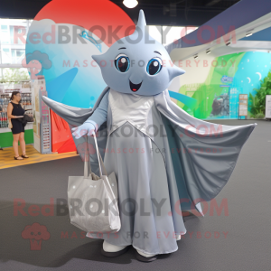 Silver Manta Ray mascot costume character dressed with a Wrap Skirt and Tote bags