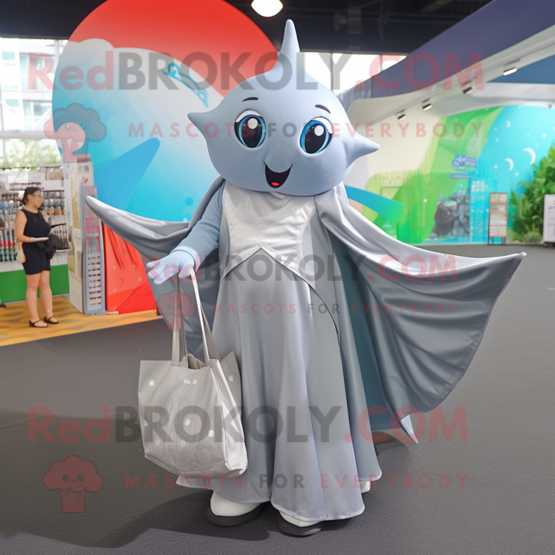 Silver Manta Ray mascot costume character dressed with a Wrap Skirt and Tote bags Silver Manta Ray mascot costume character dressed with a Wrap Skirt and Tote bags