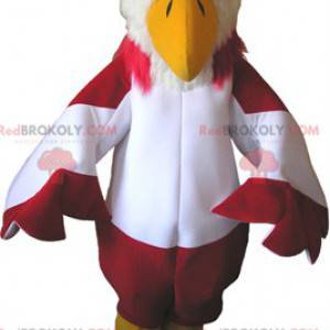 Mascotte de vautour rouge et blanc avec des bottes jaunes -