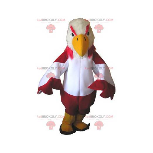 Mascote urubu vermelho e branco com botas amarelas -