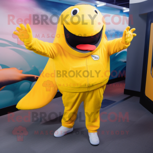 Yellow Humpback Whale mascot costume character dressed with a Joggers and Mittens