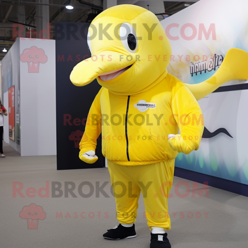 Yellow Humpback Whale mascot costume character dressed with a Joggers and Mittens