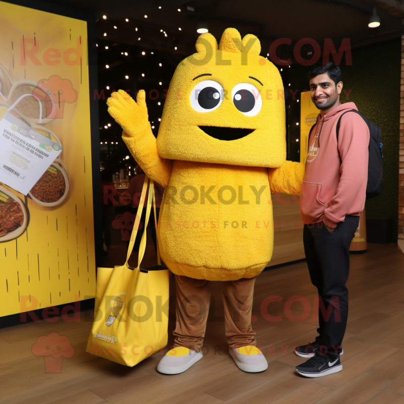 Yellow Biryani mascot costume character dressed with a Sweatshirt and Tote bags Yellow Biryani mascot costume character dressed with a Sweatshirt and Tote bags