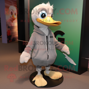 Gray Gosling mascot costume character dressed with a Hoodie and Shoe laces