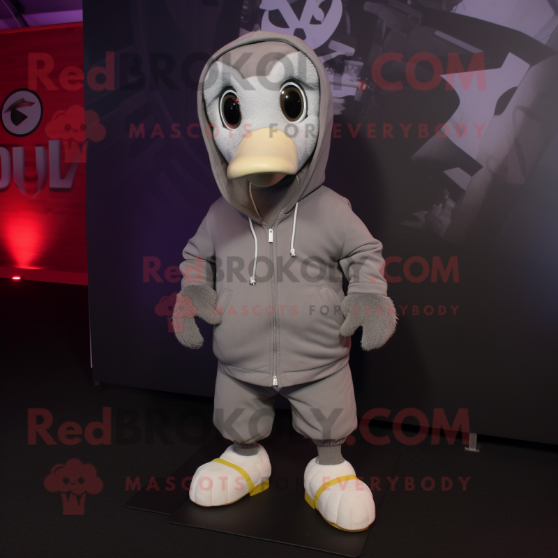 Gray Gosling mascot costume character dressed with a Hoodie and Shoe laces