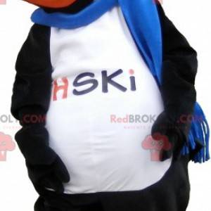 Mascota de pato gigante negro y naranja con una bufanda -