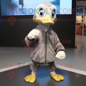 Gray Gosling mascot costume character dressed with a Hoodie and Shoe laces