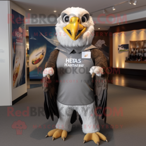 Silver Haast'S Eagle mascot costume character dressed with a Rash Guard and Tie pins