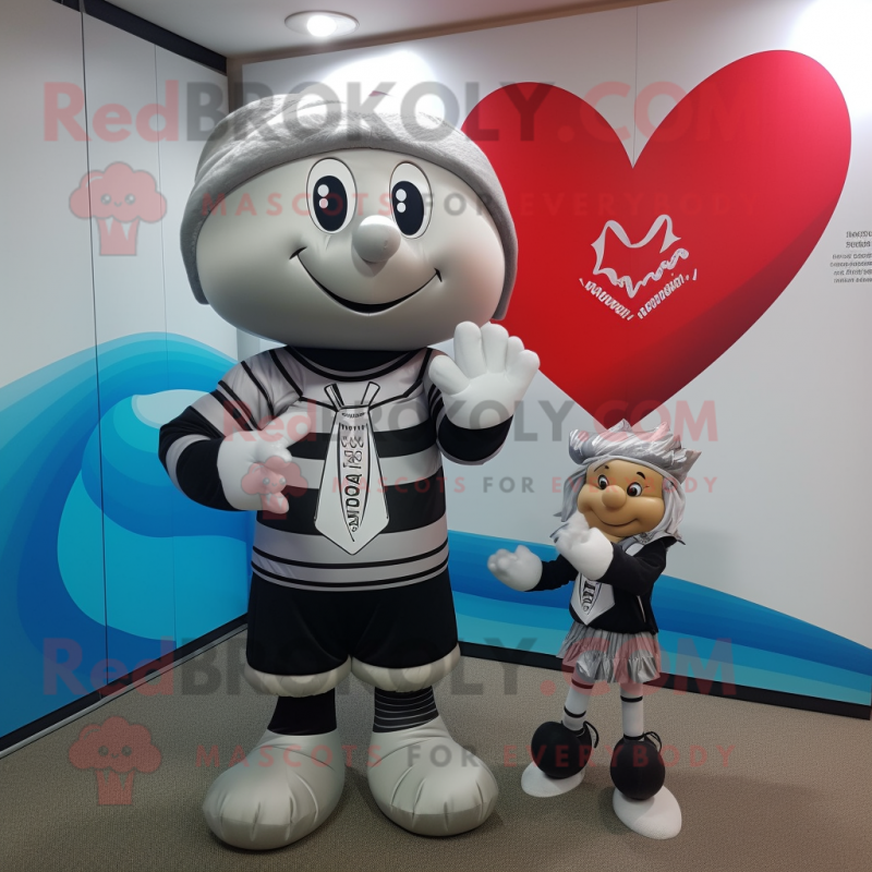 Silver Arrow Of Love mascot costume character dressed with a Rugby Shirt and Beanies Silver Arrow Of Love mascot costume character dressed with a Rugby Shirt and Beanies