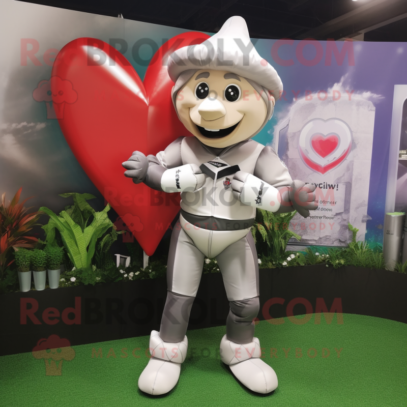 Silver Arrow Of Love mascot costume character dressed with a Rugby Shirt and Beanies Silver Arrow Of Love mascot costume character dressed with a Rugby Shirt and Beanies
