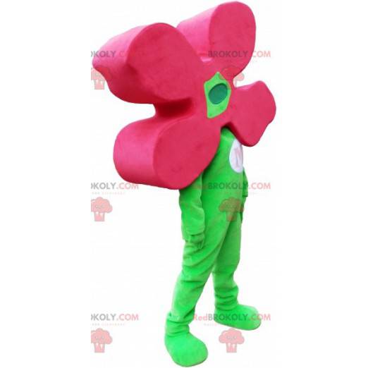Grön maskot för snögubbe med en blomma som huvud -