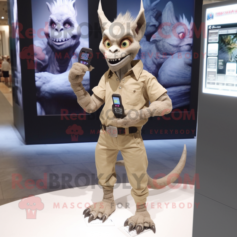 Tan Gargoyle mascot costume character dressed with a Skinny Jeans and Digital watches Tan Gargoyle mascot costume character dressed with a Skinny Jeans and Digital watches