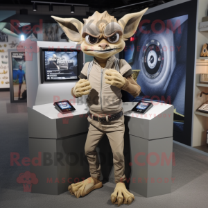 Tan Gargoyle mascot costume character dressed with a Skinny Jeans and Digital watches