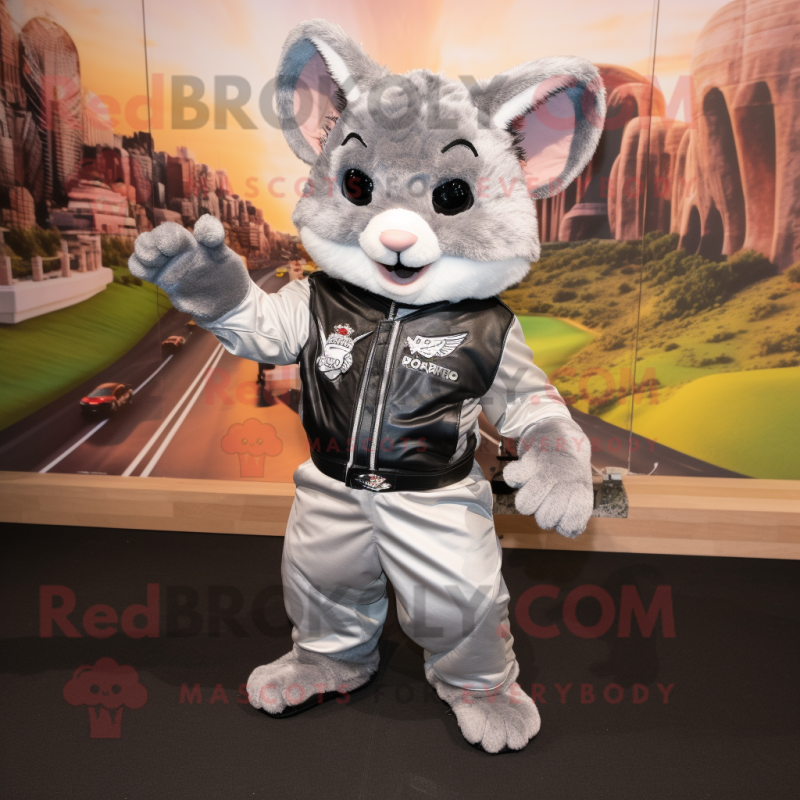 Silver Chinchilla mascot costume character dressed with a Moto Jacket and Suspenders