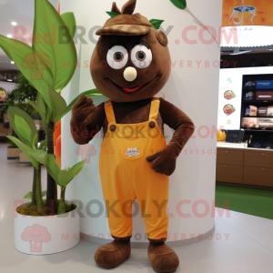 Brown Mango mascot costume character dressed with a Dungarees and Bracelet watches