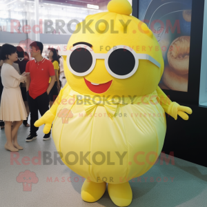 Lemon Yellow Dim Sum mascot costume character dressed with a Dress and Sunglasses