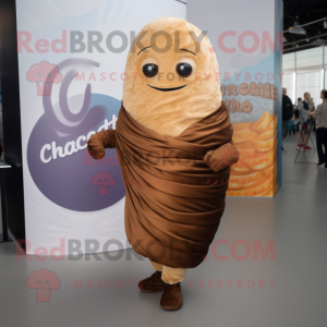 Brown Croissant mascot costume character dressed with a Playsuit and Shawl pins