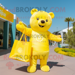 Lemon Yellow Bear mascot costume character dressed with a Jumpsuit and Tote bags