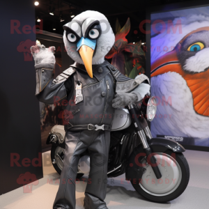 Silver Toucan mascot costume character dressed with a Biker Jacket and Messenger bags