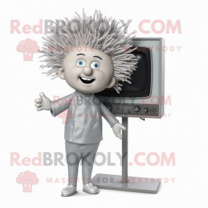 Silver Television mascot costume character dressed with a Jumpsuit and Hair clips