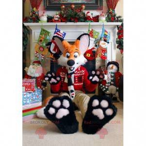 Mascote raposa laranja e branca em traje de Natal -