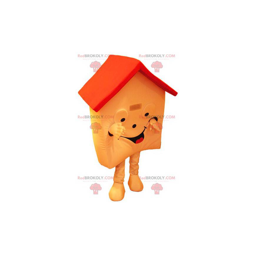 Mascotte de maison orange et rouge très souriante -