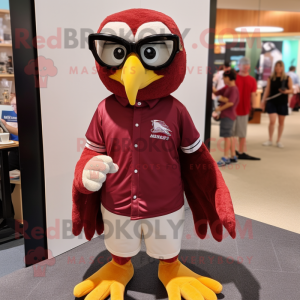 Maroon Falcon mascot costume character dressed with a Polo Shirt and Reading glasses