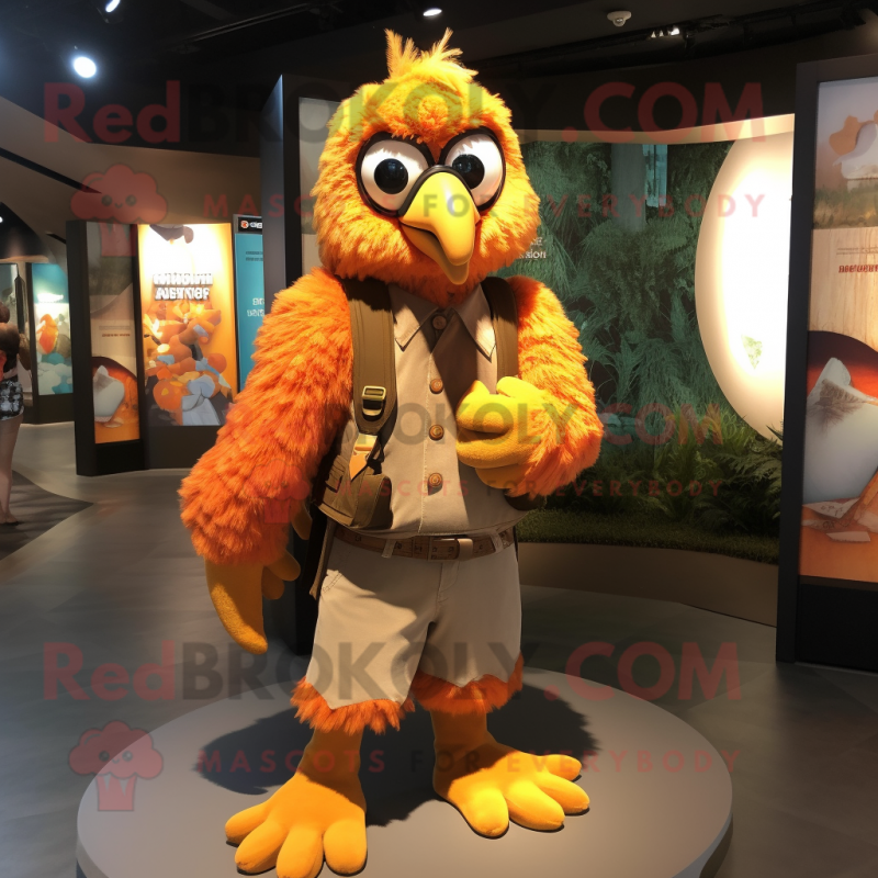 Orange Harpy mascot costume character dressed with a Waistcoat and Backpacks Orange Harpy mascot costume character dressed with a Waistcoat and Backpacks