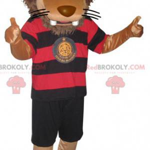 Mascote leão grande em roupas esportivas pretas e vermelhas -