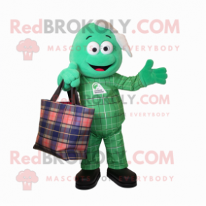 Green Astronaut mascot costume character dressed with a Flannel Shirt and Tote bags