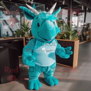 Turquoise Rhinoceros mascot costume character dressed with a T-Shirt and Hairpins