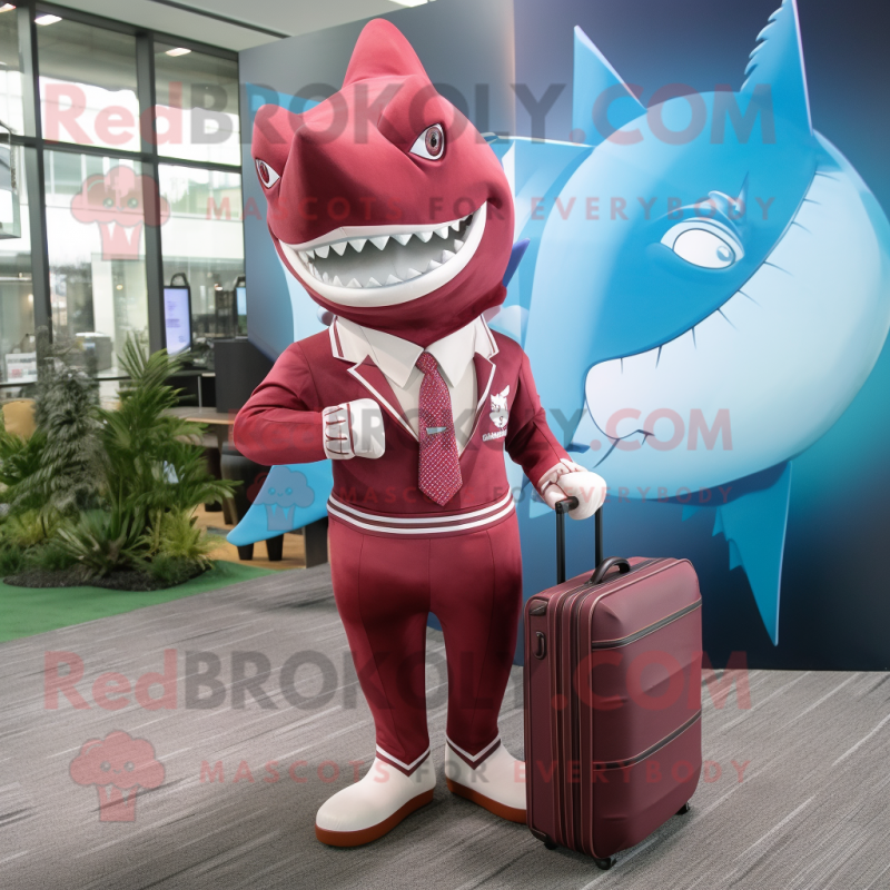 Maroon Shark mascot costume character dressed with a Rash Guard and Briefcases