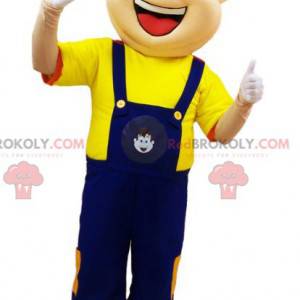 Homem mascote de macacão azul e camiseta amarela -
