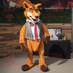 Rust Dingo mascot costume character dressed with a Blazer and Hair clips