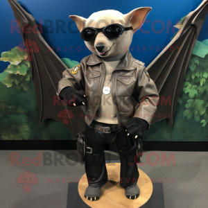 Tan Fruit Bat mascot costume character dressed with a Biker Jacket and Bracelet watches