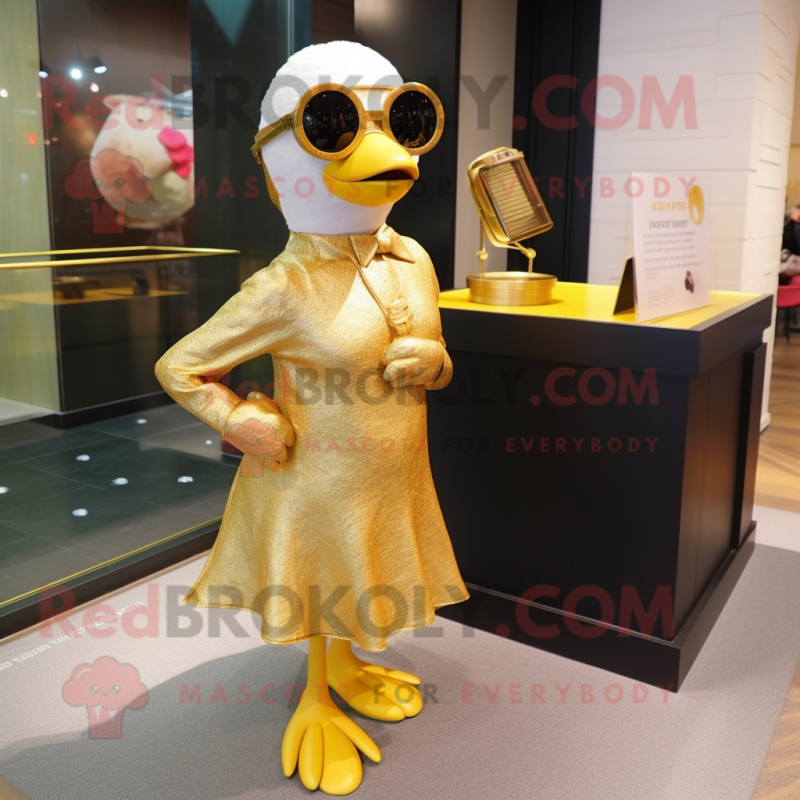 Gold Gosling mascot costume character dressed with a Wrap Skirt and Sunglasses Gold Gosling mascot costume character dressed with a Wrap Skirt and Sunglasses