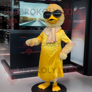 Gold Gosling mascot costume character dressed with a Wrap Skirt and Sunglasses