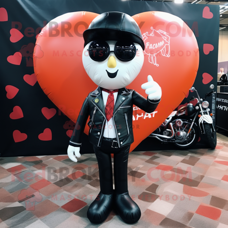 Peach Heart Shaped Balloons mascot costume character dressed with a Biker Jacket and Pocket squares Peach Heart Shaped Balloons mascot costume character dressed with a Biker Jacket and Pocket squares