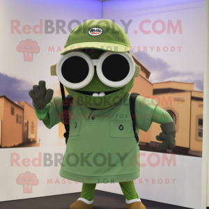 Olive Camera mascot costume character dressed with a Polo Tee and Sunglasses