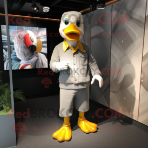 Silver Duck mascot costume character dressed with a Corduroy Pants and Cufflinks