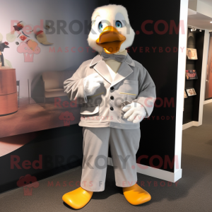 Silver Duck mascot costume character dressed with a Corduroy Pants and Cufflinks