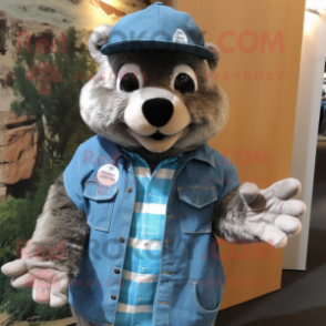 Blue Marmot mascot costume character dressed with a Denim Shirt and Gloves