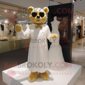 Gold Bear mascot costume character dressed with a Wedding Dress and Eyeglasses