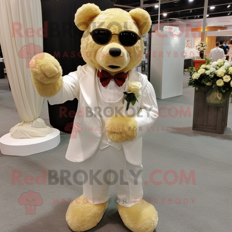 Gold Bear mascot costume character dressed with a Wedding Dress and Eyeglasses Gold Bear mascot costume character dressed with a Wedding Dress and Eyeglasses