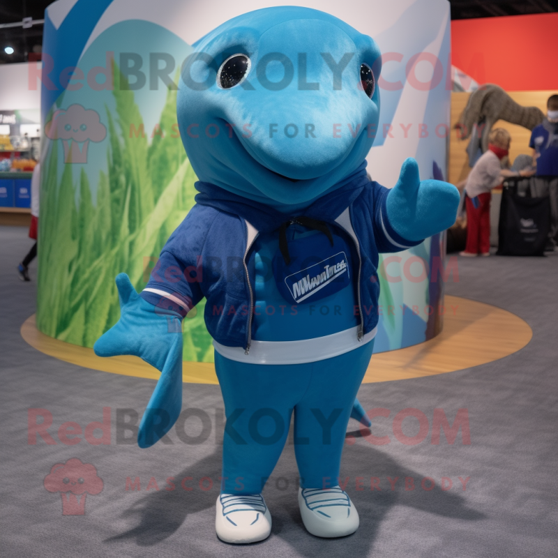 Blue Humpback Whale mascot costume character dressed with a Board Shorts and Mittens