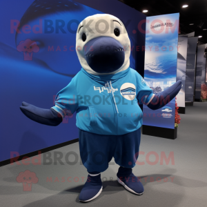 Blue Humpback Whale mascot costume character dressed with a Board Shorts and Mittens