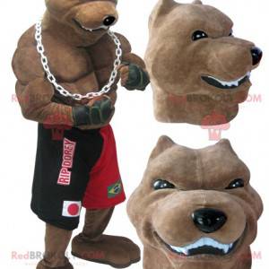 Mascotte de chien de race géant et musclé en tenue de boxeur -